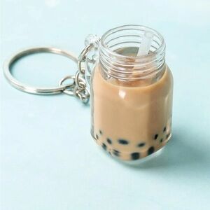 Cute bubble tea key chain in brown with black bubbles